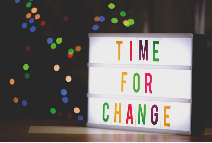 Sign reading 'Time to Change' — symbolizing the shift after broken promises and financial disillusionment.