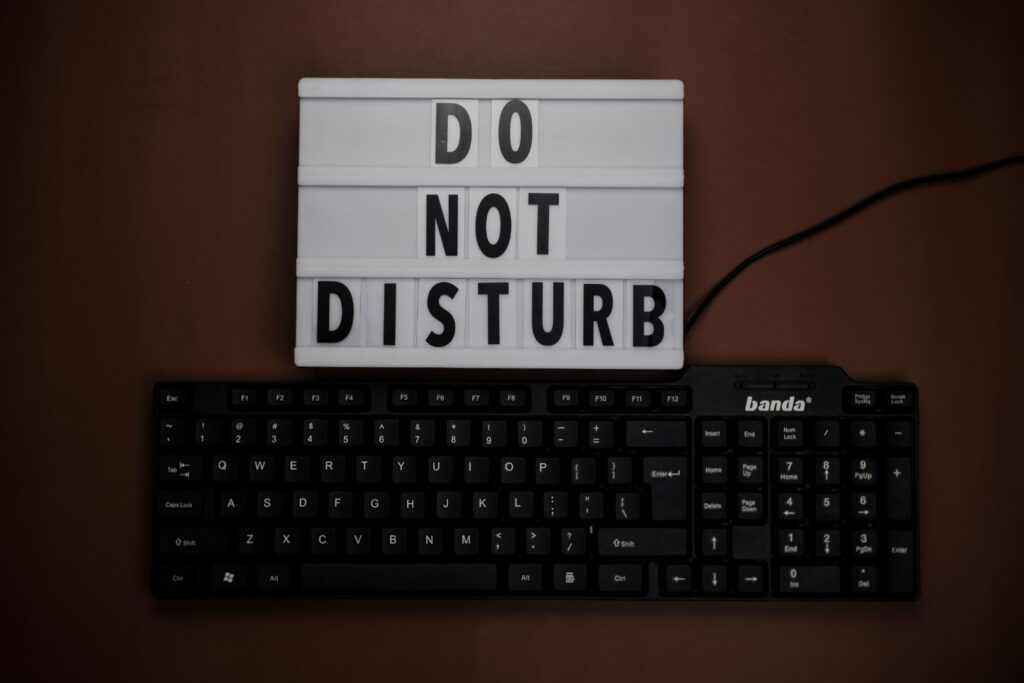 Do not disturb sign symbolising setting boundaries to prevent social media burnout.