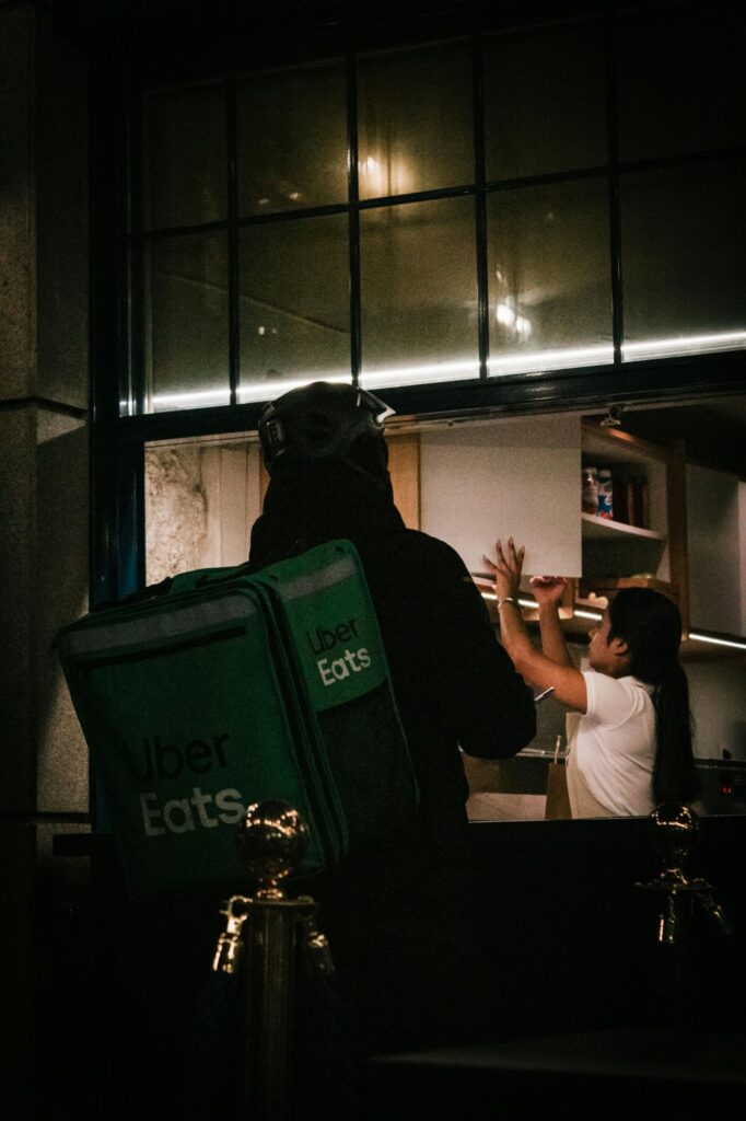 Visual of food delivery highlighting convenience culture and modern instant gratification.